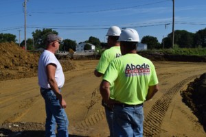 three excavators with Abode Excavation
